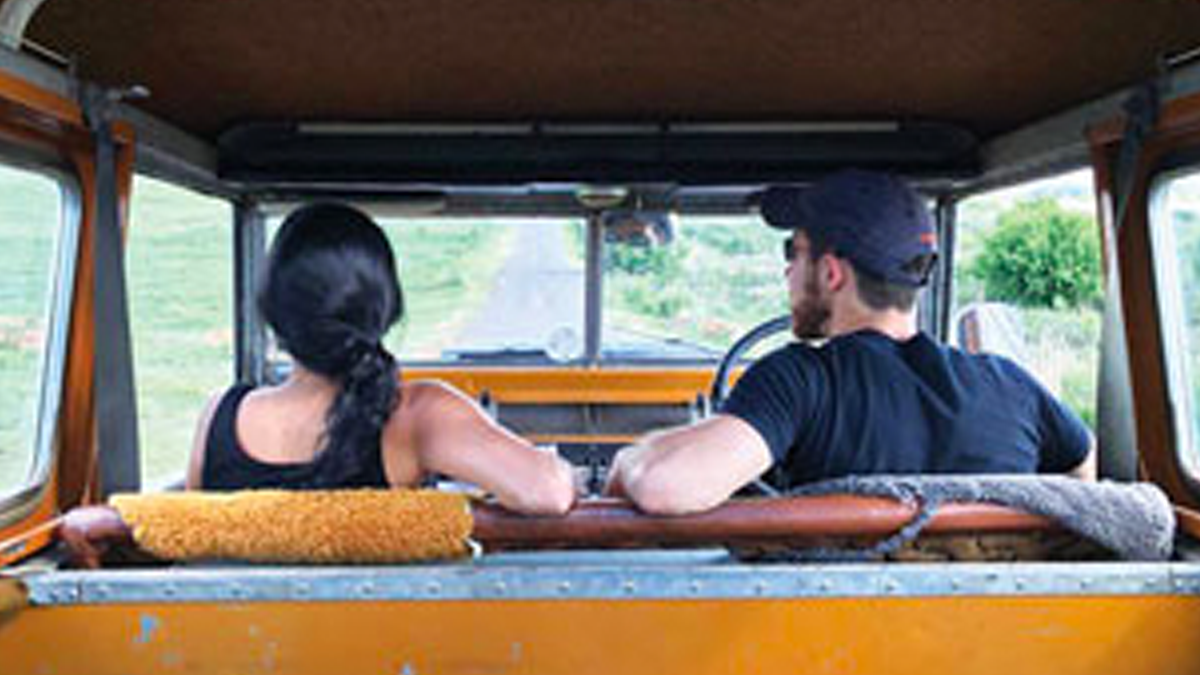Two people in a truck.